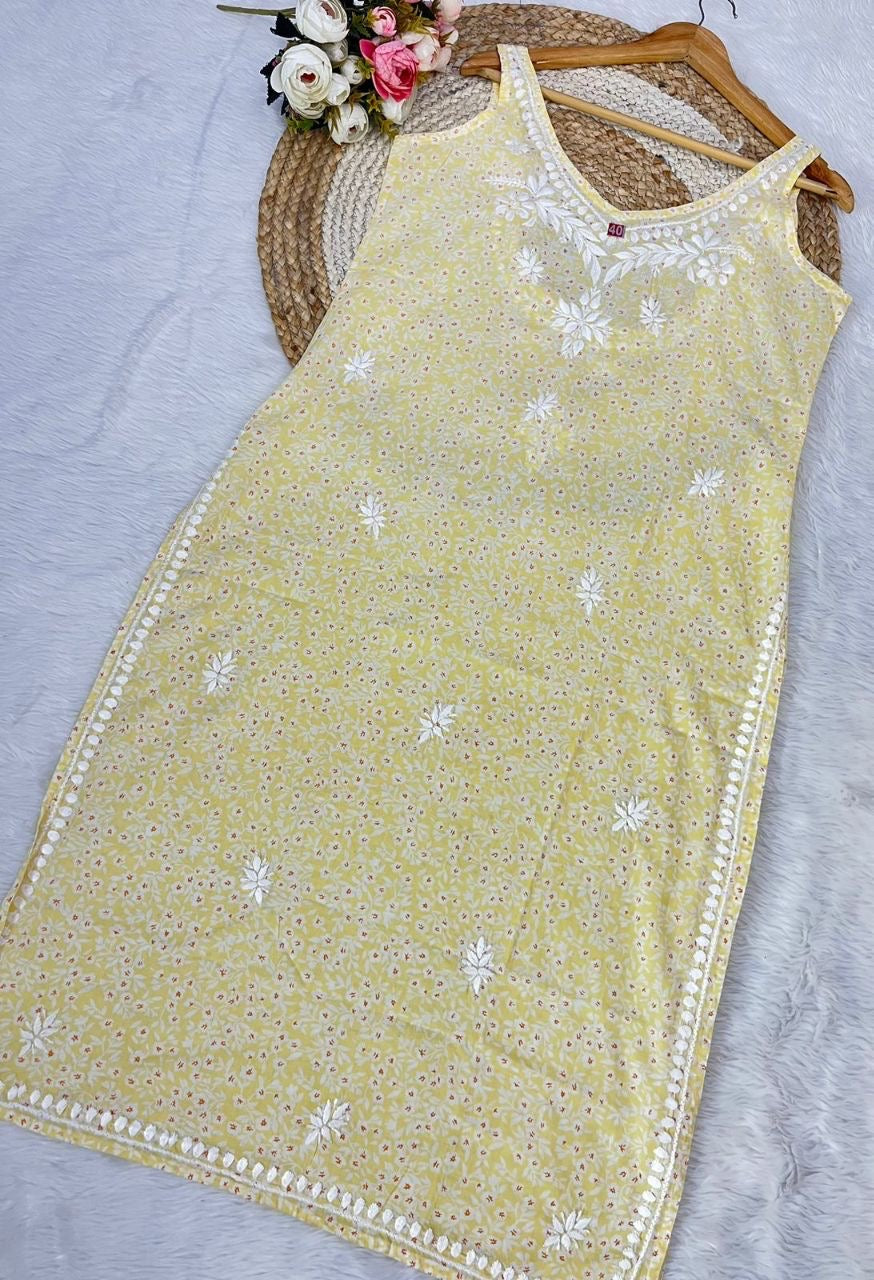 Butter Yelow Ishani Mul Mul Chikankari Kurta in white – hand-embroidered sleeveless deep back design