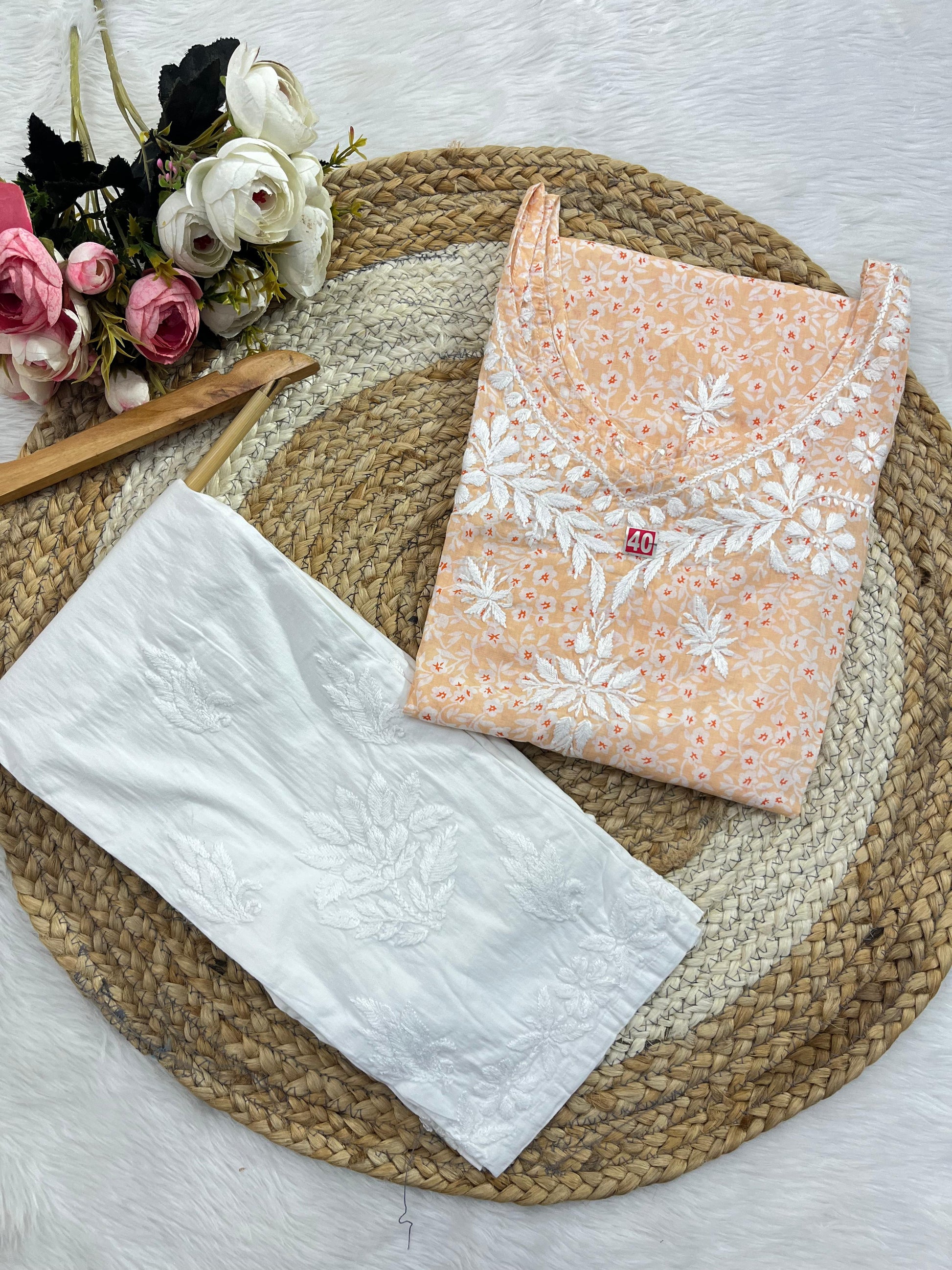 Close-up of Chikankari embroidery on mul mul fabric of Peach Ishani  Mul Mul Chikankari kurta